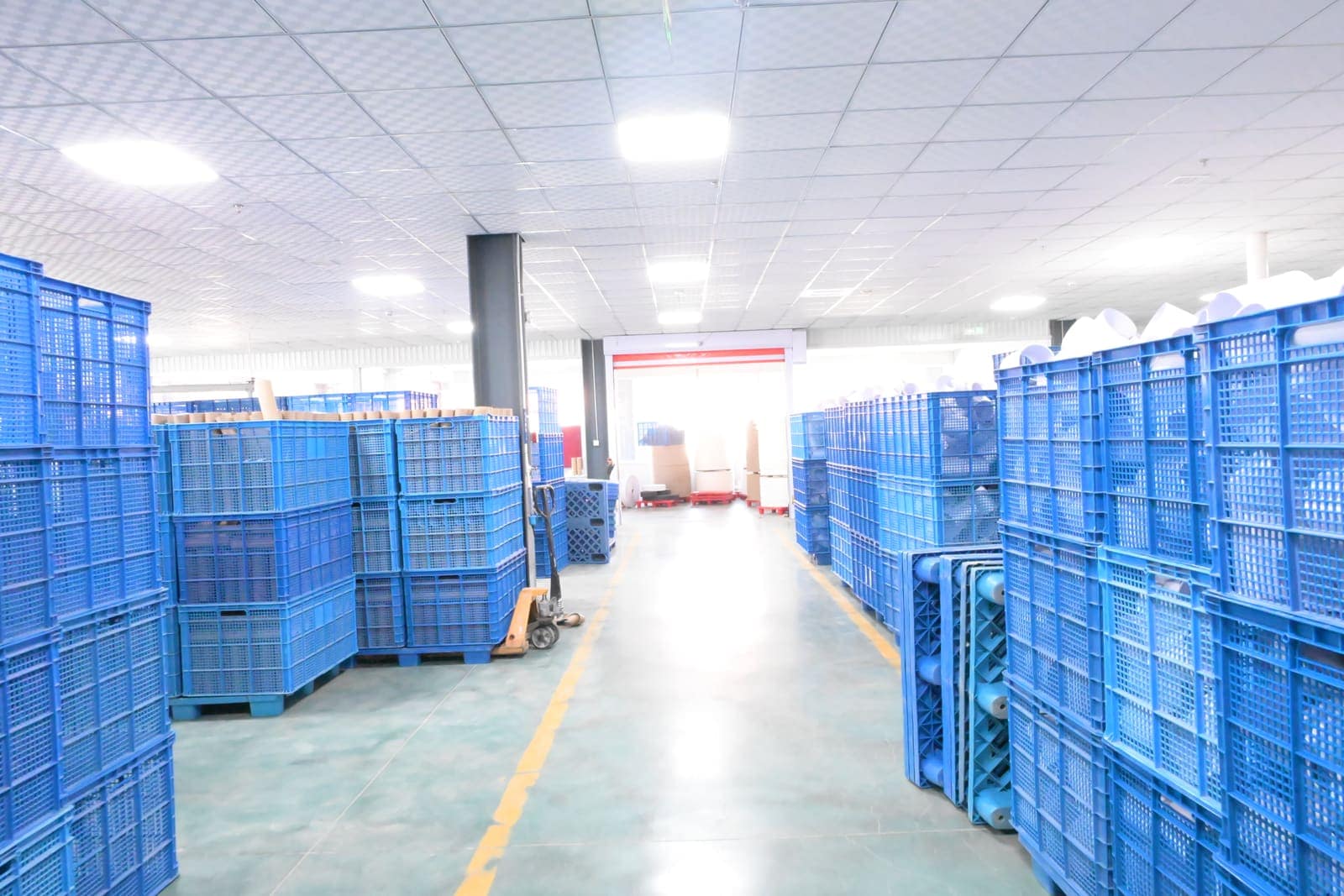 Organized warehouse aisle with staged materials ready for production