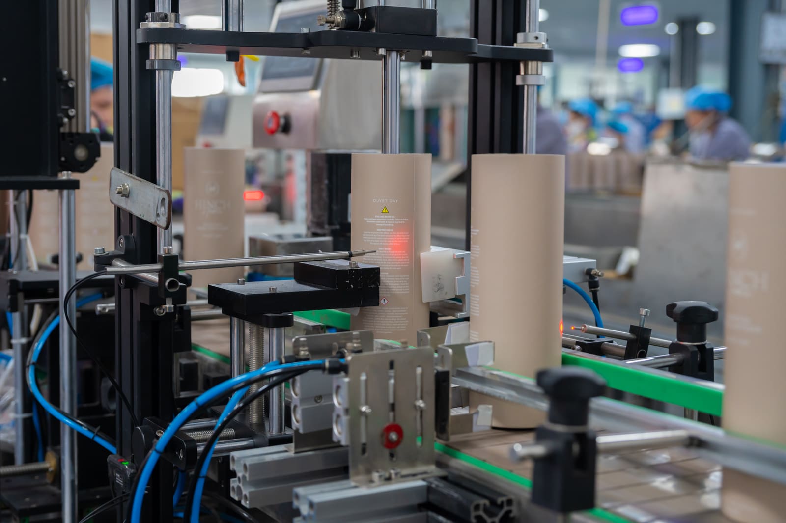 Automated paper tube line with in-process quality inspection sensors