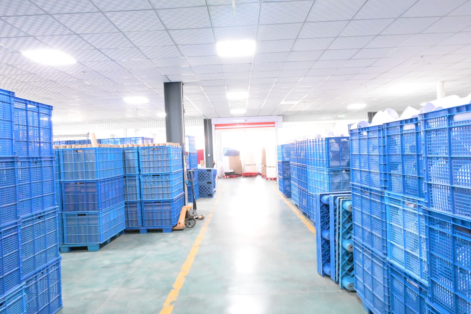 Organized warehouse aisle with staged materials ready for production
